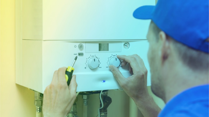 engineer installing a modern heating system for energy home improvement